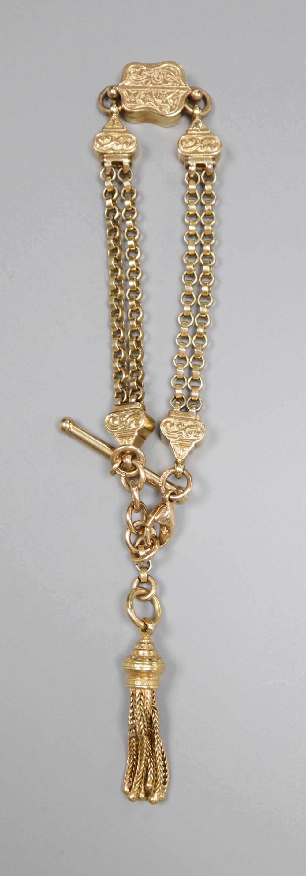 A 9ct gold double chain bracelet with engraved shaped box links, tassel suspension and bolt and ring clasp, 16.3cm, 20.4g.